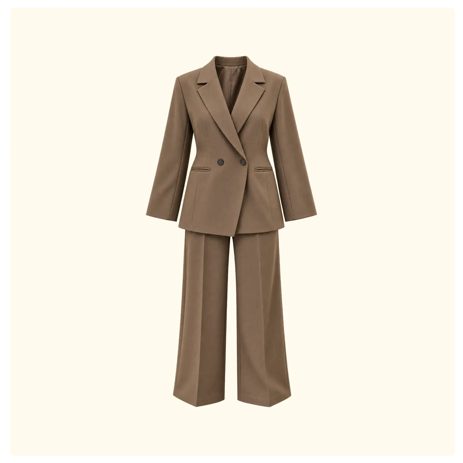 Elegant women’s mocha brown two-piece suit featuring a structured double-breasted blazer and matching tailored trousers. A sophisticated set for work, meetings, dinners and smart-casual occasions.