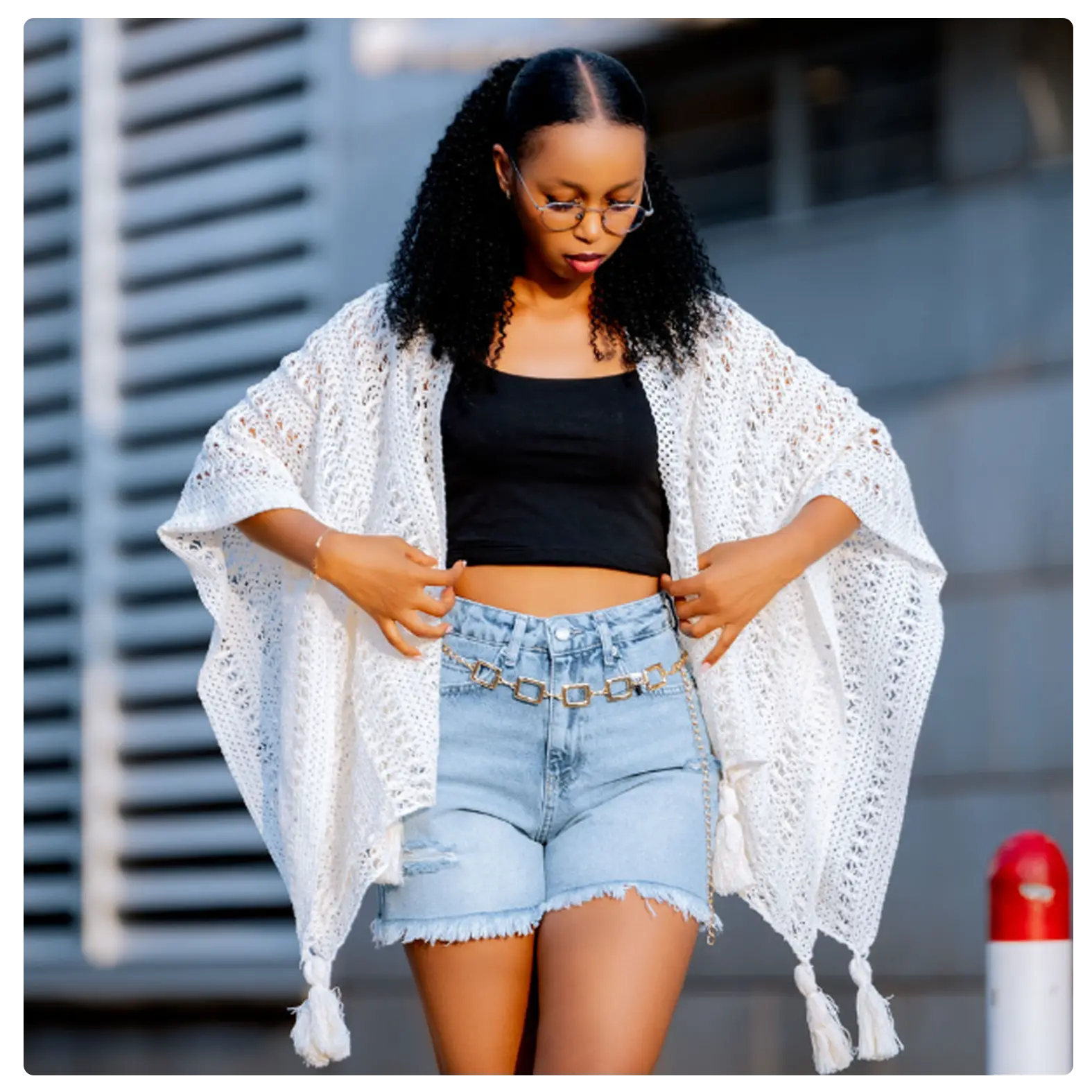 A lightweight ivory crochet kimono featuring an intricate open-knit pattern, relaxed oversized silhouette and statement tassel details. Perfect for layering over dresses, tops, swimwear and casual outfits.